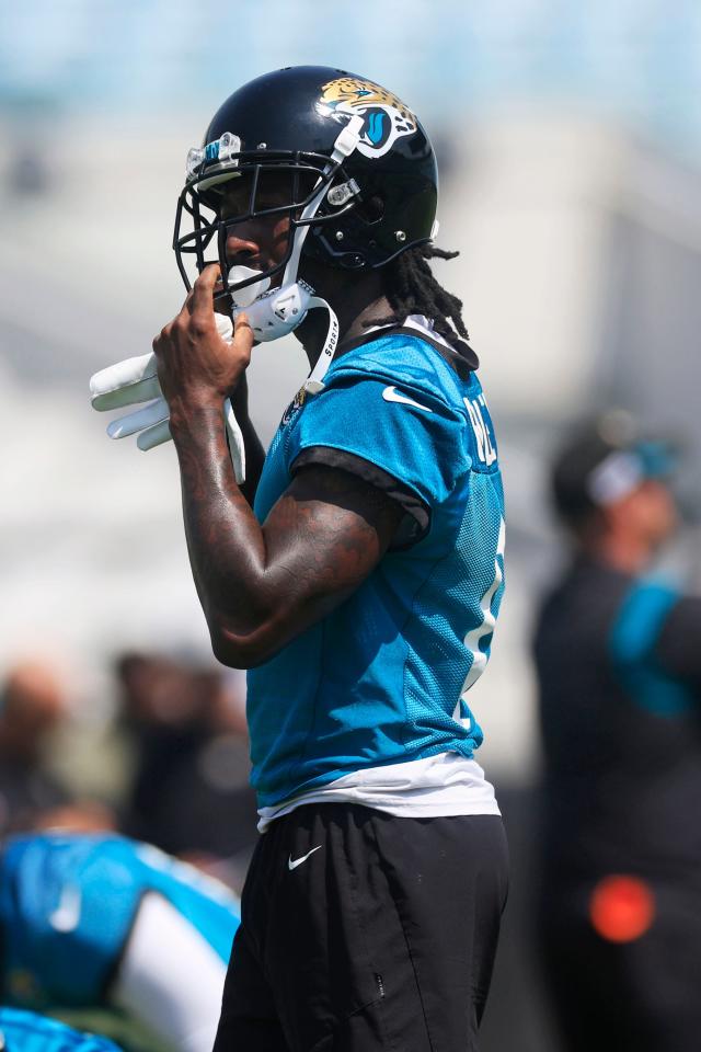 Jacksonville Jaguars wide receiver Calvin Ridley (0) puts on his helmet during an organized team activity Tuesday, May 30, 2023 at TIAA Bank Field in Jacksonville, Fla. 