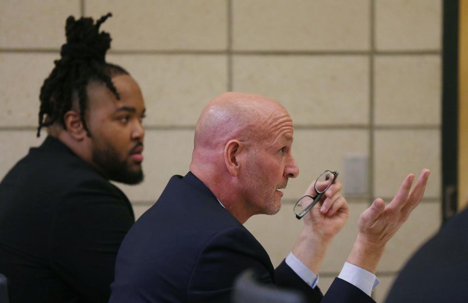 Defense attorney Van Plumb argues as he represents his client, former Iowa State defensive line Eyioma Uwazurike, left, against gambling charges in Story County court.