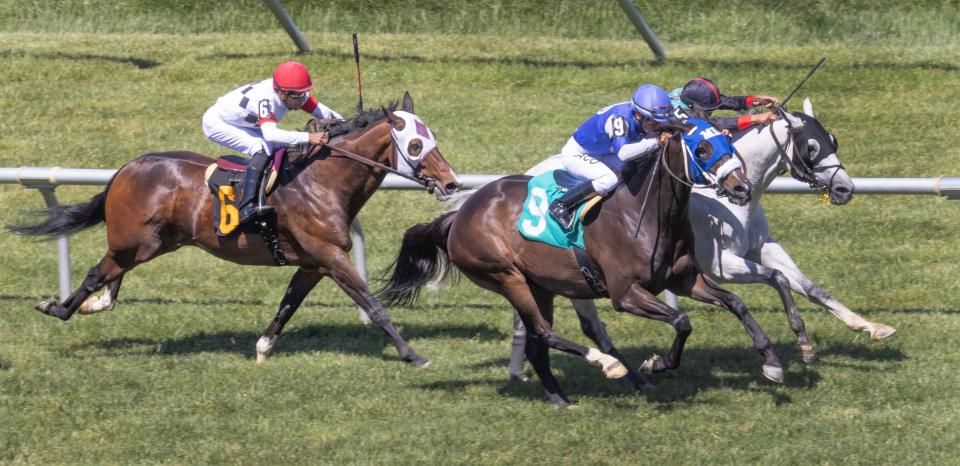 Fatima’s Blessing, ridden by Paco Lopez, pulls ahead at the finish of the fourth race on May 11 at Monmouth Park. Lopez won on 14 of his 33 mounts at Delaware Park last season.