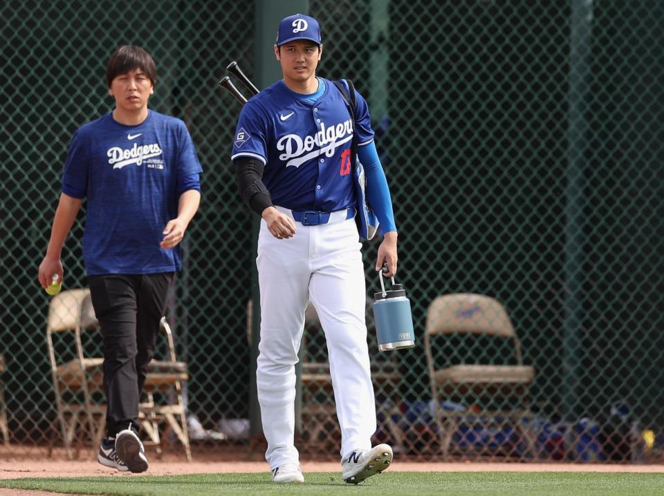 PHOTO: Shohei Ohtani #17 of the Los Angeles Dodgers and interpreter Ippei Mizuhara arrive to a game against the Chicago White Sox at Camelback Ranch on Feb. 27, 2024 in Glendale, Ariz. (Christian Petersen/Getty Images, FILE)