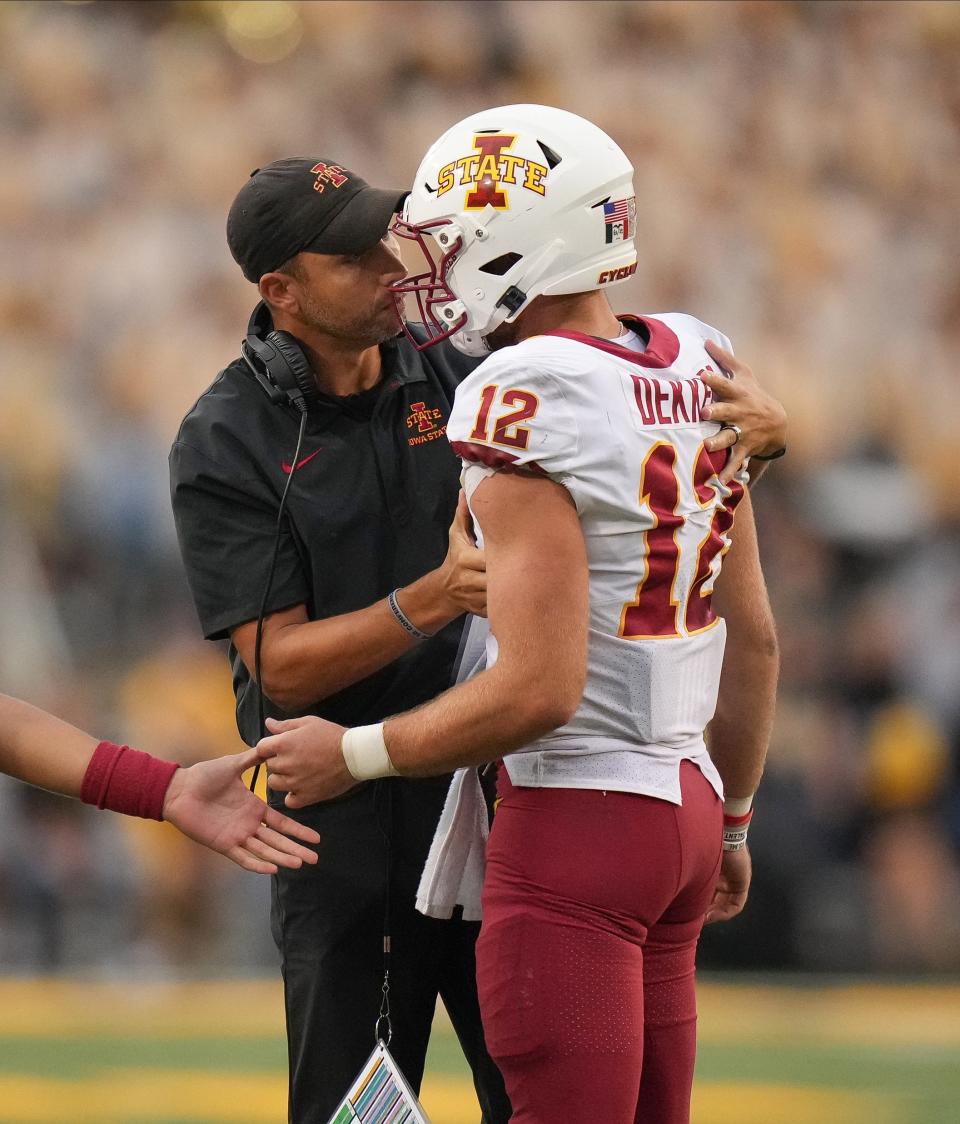 Iowa State head football coach Matt Campbell talks with quarterback Hunter Dekkers during the Cy-Hawk Series football game against Iowa on Saturday, Sept. 10, 2022, at Kinnick Stadium in Iowa City.