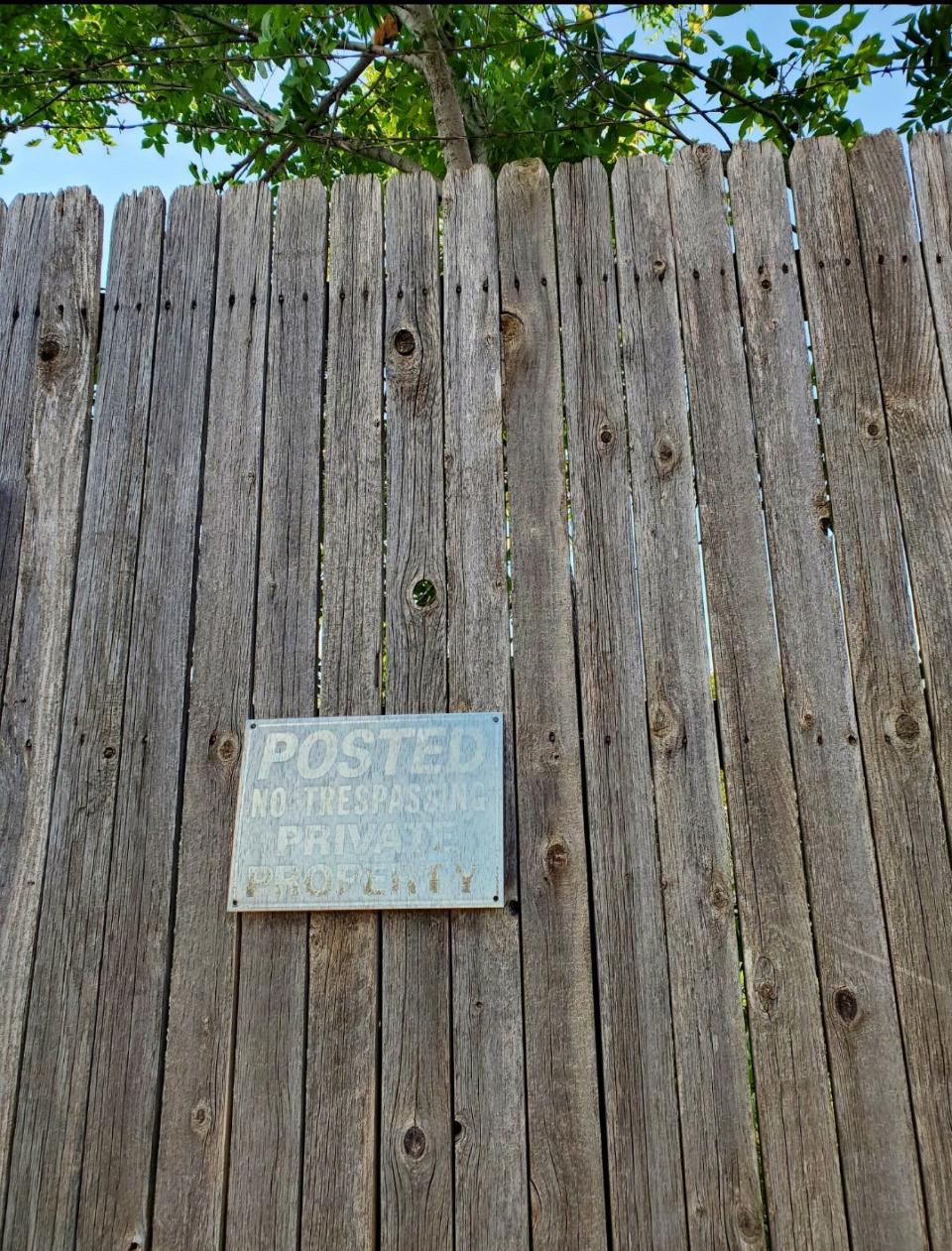 A section of fencing that surrounded "the compound" can still be seen along Edmond Road. Photo by Steve Lackmeyer