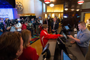 Surrounded by members of the media, Gov. Laura Kelly hands over $15 to place the first legal sports bet in the state at noon Thursday at Barstool Sportsbook inside Hollywood Casino. Kelly placed the bet on the Kansas City Chiefs to win the Super Bowl.