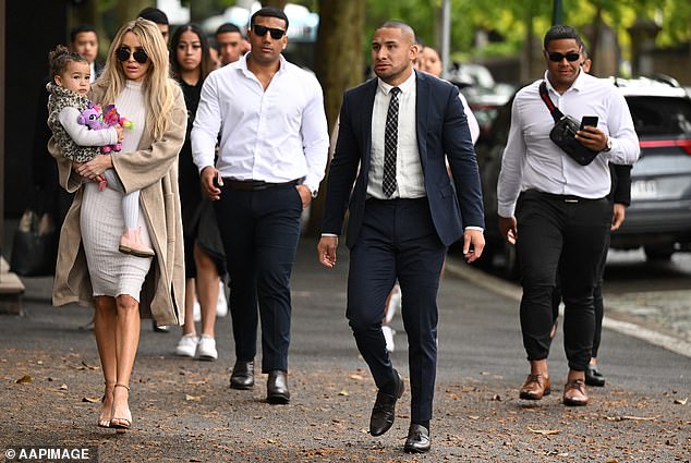 Jamil Hopoate (second from right, in blue suit and tie) was jailed for a maximum of three years and nine months on Thursday