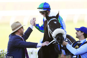 Chittick's horse I wish I win took out the $10million Gold Eagle at the races at Rosehill in Sydney (pictured is jockey Luke Nolen celebrating with trainer Peter Moody)