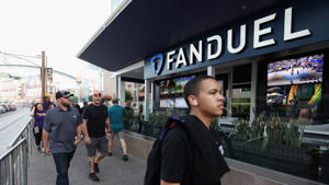 Fans walk past a Fanduel sports betting location at Footprint Center before Game Five of the Western Conference First Round NBA Playoffs between the Phoenix Suns and the New Orleans Pelicans on April 26, 2022, in Phoenix, Arizona.