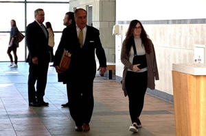 Karen Eames walks into court with her lawyer Michael Vavonese in Syracuse on Tuesday, April 11, 2023.