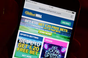 Gambling firms must perform new checks on those losing £125 a month under long-delayed white paper