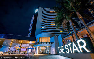 The Star Casino group has announced they will cut 500 jobs and freeze wages (pictured The Star Casino on the Gold Coast)