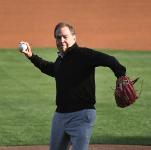 Alabama head football coach Nick Saban throws out the first pitch before the Crimson TideÕs game with Samford at Sewell-Thomas Stadium Tuesday April 25, 2023.