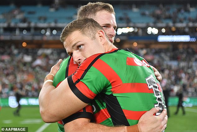 George and brother Tom (right) are pictured at the height of their playing success when both represented Souths and won the 2014 premiership