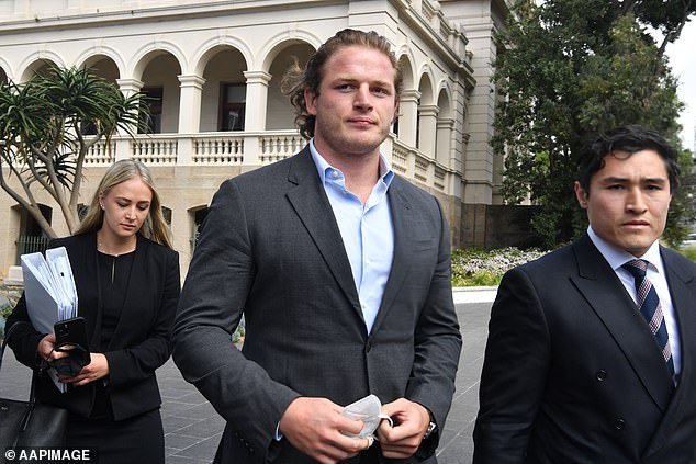 Burgess (pictured with lawyer Bryan Wrench, right) entered a plea of not guilty when he was charged with sexual touching without consent