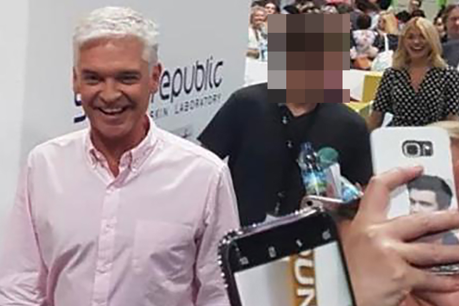 Phil Schofield snapped with young aide as insider says relationship was 'odd'