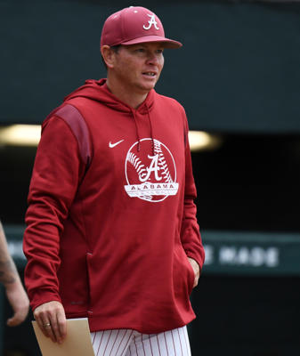 Alabama Head Coach Brad Bohannon brings the lineups to home plate before the game with UNA in Sewell-Thomas Stadium Wednesday, March 9, 2022.