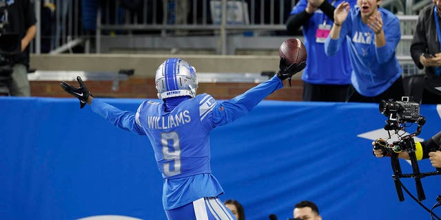 Jameson Williams celebrates a TD