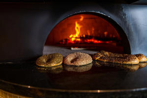 A wood-fired oven sends out Jerusalem-style bagels.