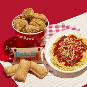 Jollibee’s buckets of fried “chickenjoy” with brown gravy, sweet cheesy spaghetti loaded with hot dogs and ham, and peach mango handpies.