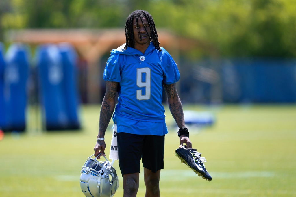 Lions wide receiver Jameson Williams (9) walks off the field after an NFL football practice 