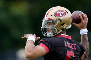 San Francisco 49ers quarterback Trey Lance throws during workouts.