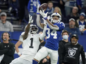 Indianapolis Colts cornerback Isaiah Rodgers intercepts a pass intended for Las Vegas Raiders wide receiver DeSean Jackson in 2022.