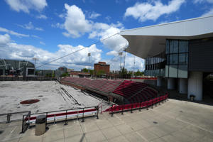 Installation of a new playing surface continues at the University of Cincinnati Baseball Stadium, Monday, June 12, 2023, in Cincinnati. The university is set to move into the Big 12 Conference in July.