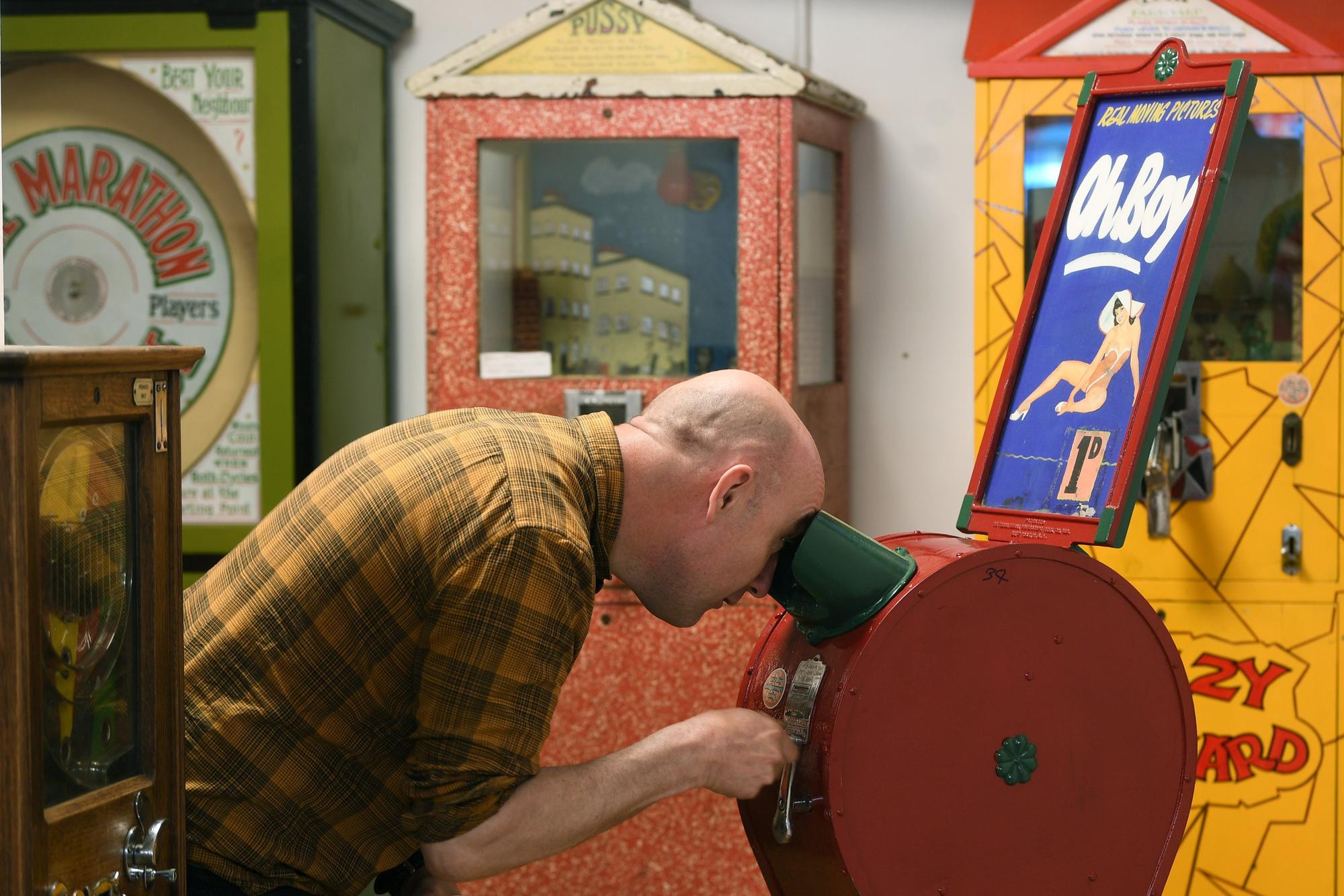 Old Penny Lane Family Entertainment Centre with victorian and vintage games, on Feasegate in York. Grant Parker playing games.