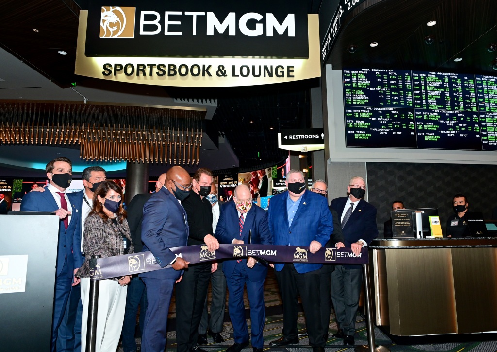 Maryland Governor Larry Hogan cuts the ribbon as MGM National Harbor, Governor Larry Hogan and Joe Theismann launch sports betting in Maryland