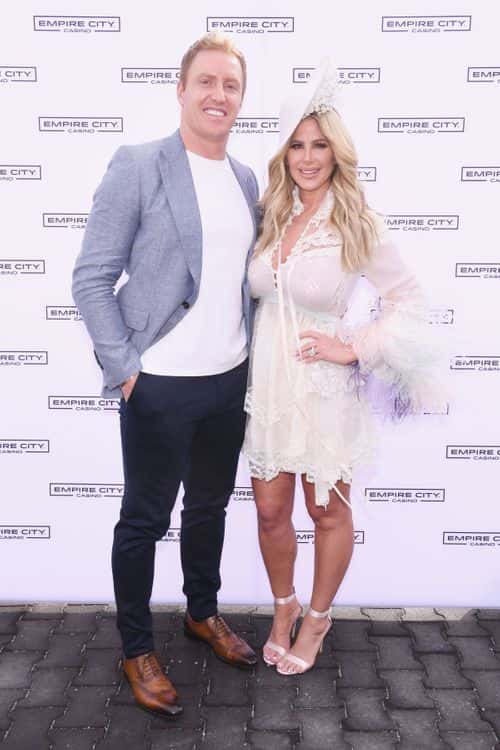 NFL Player Kroy Biermann (L) and TV Personality Kim Zolciak attend as Kim Zolciak hosts the Kentucky Derby hat contest at Empire City Casino at Yonkers Raceway on May 6, 2017 in Yonkers, New York.