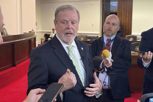 North Carolina state Senate leader Phil Berger, left, R-Rockingham, speaks to reporters on the Senate floor of the Legislative Building in Raleigh, N.C., on Wednesday May 31, 2023. Berger voted for a measure that would legalize sports wagering in the state. (AP Photo/Gary D. Robertson)