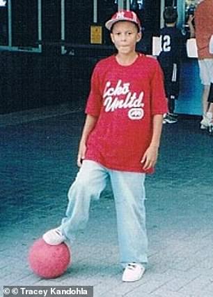 A young Dele Alli pictured with a football as a child