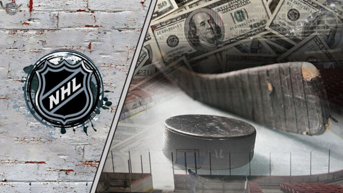 Picture of a hockey stick and a puck with money in the background.