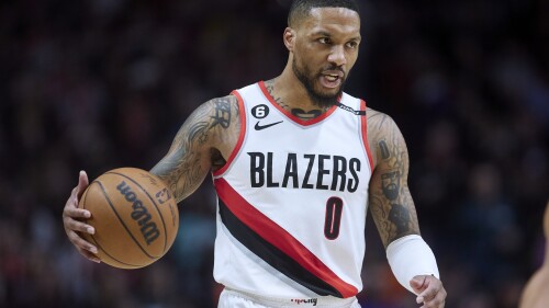 FILE - Portland Trail Blazers guard Damian Lillard brings the ball up against the New York Knicks during the second half of an NBA basketball game in Portland, Ore., Tuesday, March 14, 2023. Damian Lillard asked his team for a trade Saturday, July 1, a person with knowledge of the matter told The Associated Press. (AP Photo/Craig Mitchelldyer, File)