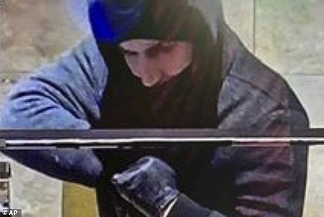 This photo provided by the Las Vegas Metropolitan Police Department allegedly shows Rogers suspect captured by security cameras  during a robbery at the Aliante hotel-casino