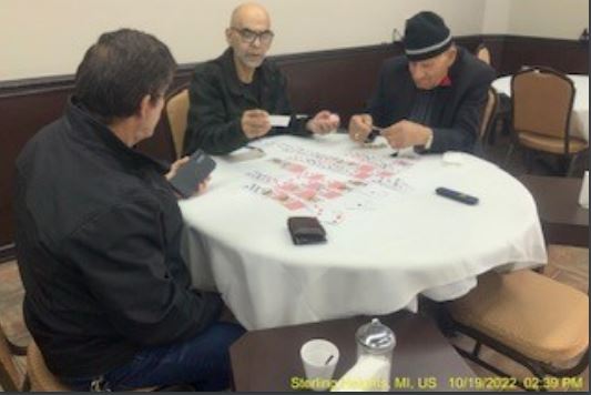 Men play cards at a table in Tarboosh Cafe. (PHOTO -- STERLING HEIGHTS PLANNING DEPARTMENT)