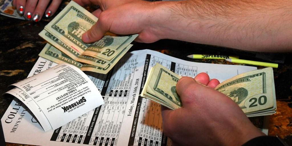 A bookie takes bets at a sportsbook operation