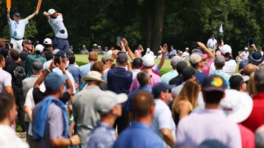 jon rahm hits in front of fans