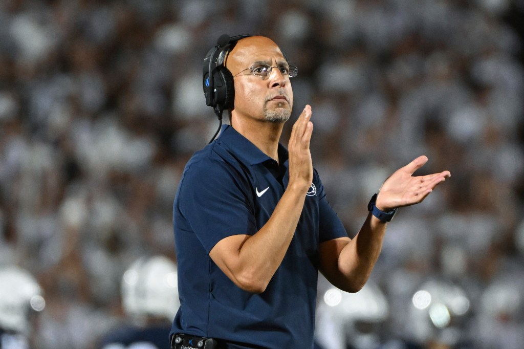 James Franklin clapping on the sideline.