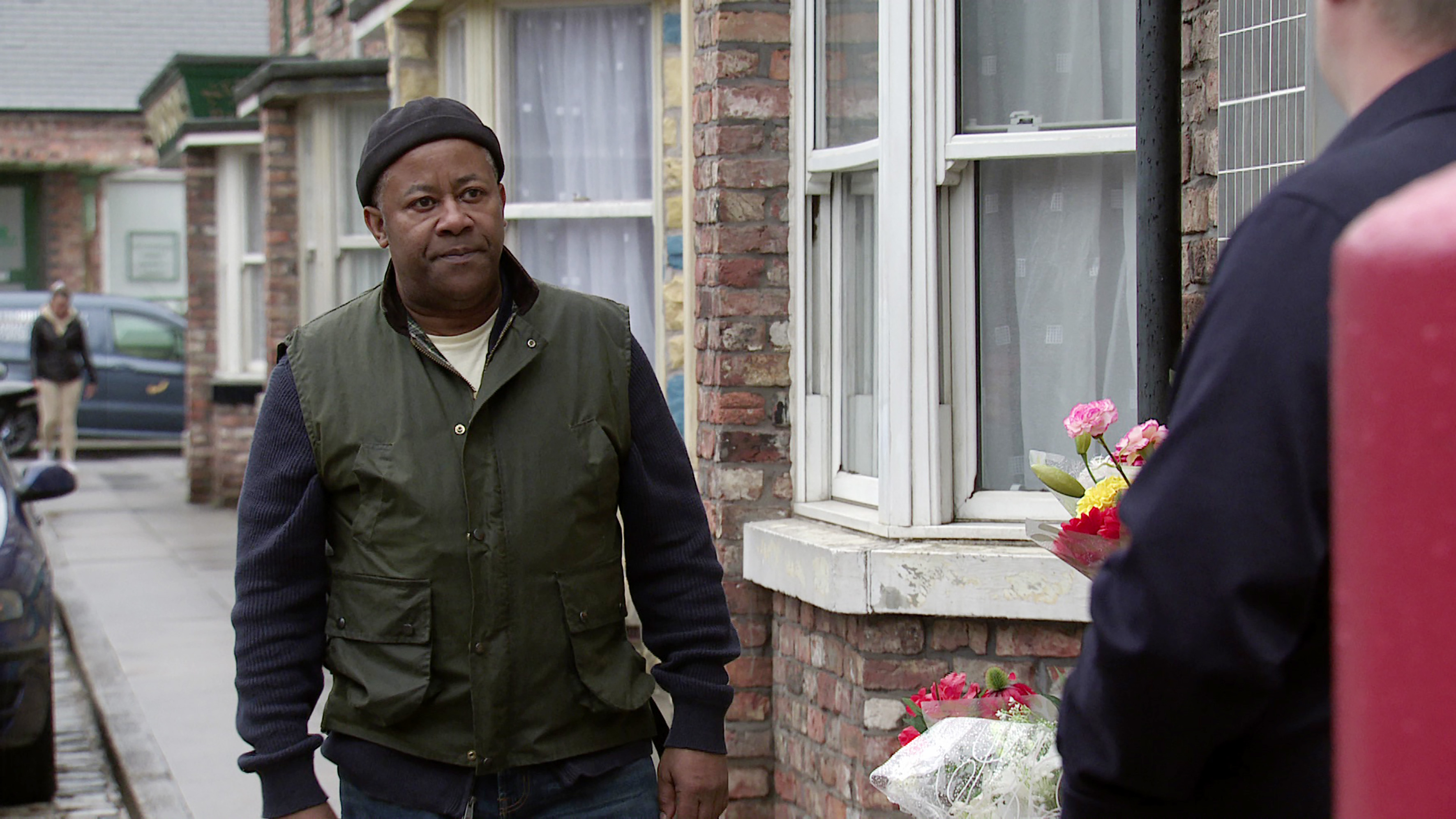 Ed outside Dev's shop in Corrie