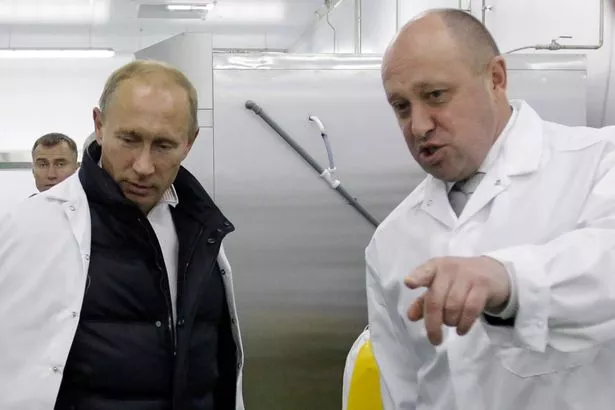 Vladimir Putin with Yevgeny Prigozhin in happier times before the fatal plane crash