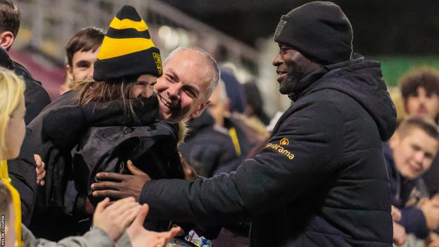 Maidstone boss George Elokobi chats with fans