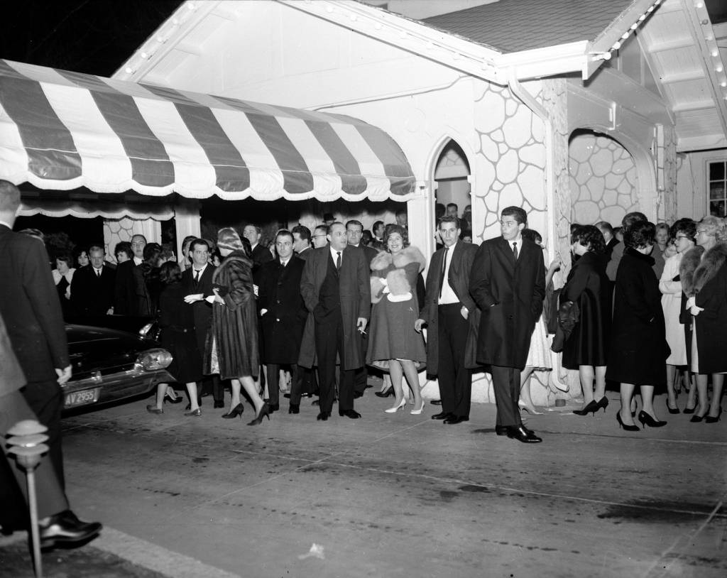 Crowds wait for their cars outside Villa Venice after the Frank Sinatra, Dean Martin and Sammy Davis Jr. show on Nov. 26, 1962. 