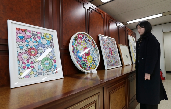 Art by Takashi Murakami and others that was allegedly bought with proceeds from an illegal gambling website are seen after being confiscated by prosecutors in Busan on Monday. [NEWS1]