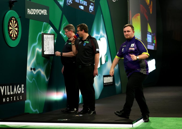 LONDON, ENGLAND - DECEMBER 30: Luke Littler of England celebrates during his round four match against Raymond van Barneveld of Netherlands on day 13 of the 2023/24 Paddy Power World Darts Championship at Alexandra Palace on December 30, 2023 in London, England. (Photo by Tom Dulat/Getty Images)