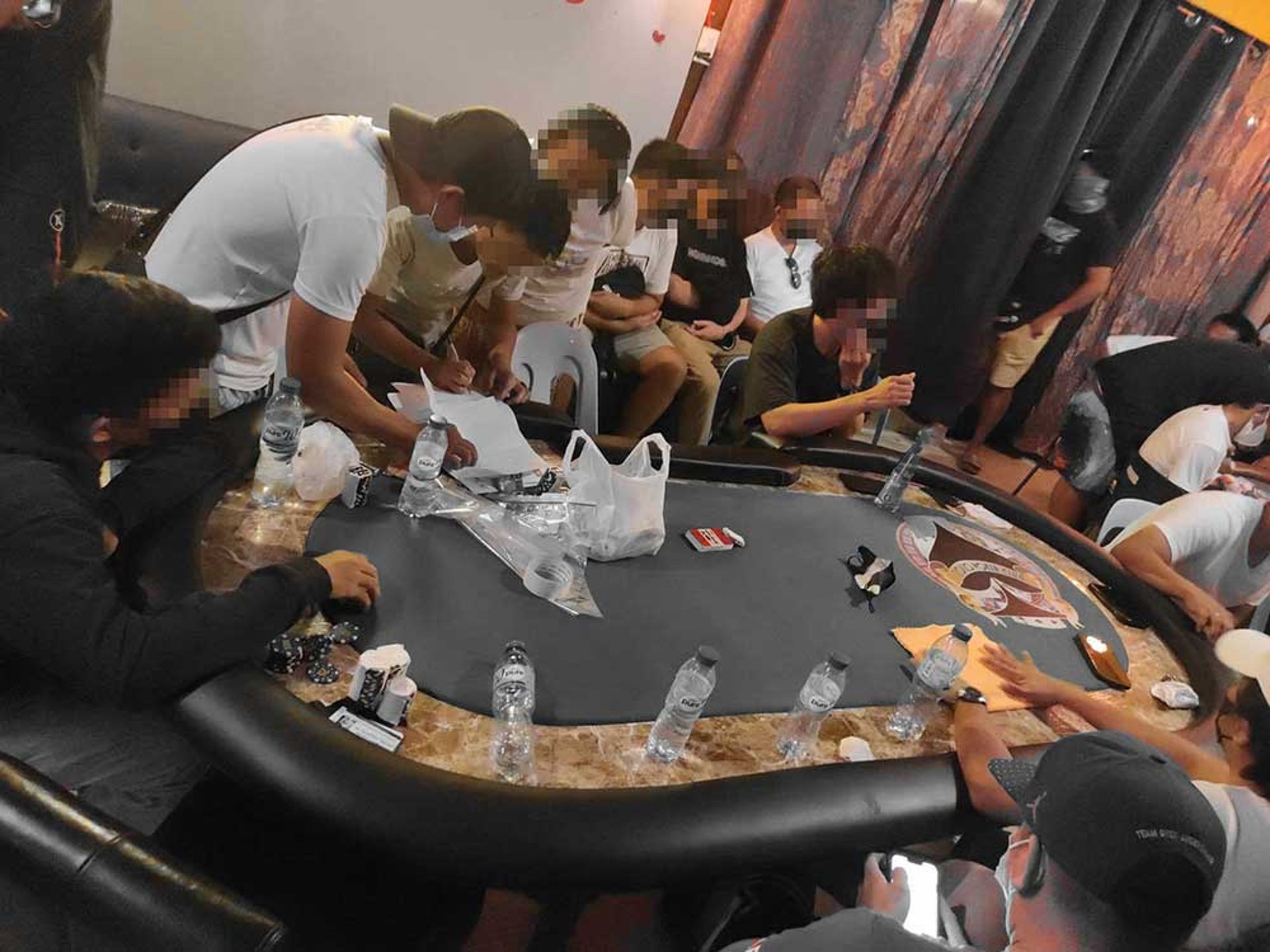 Cop, fire officer among 28 arrested in illegal gambling raid
