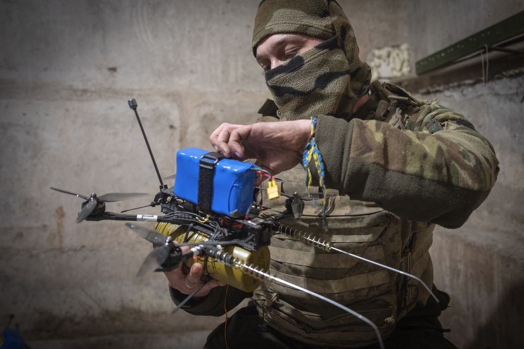 Ukrainian soldiers prepare an explosive drone in Donetsk in March 2024.