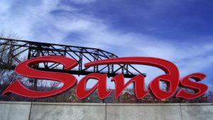 a red sign with the Las Vegas Sands (LVS) logo