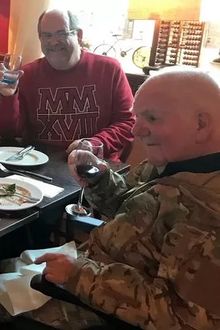 Carer Allan Beacham with Alan Pattillo at a dinner table