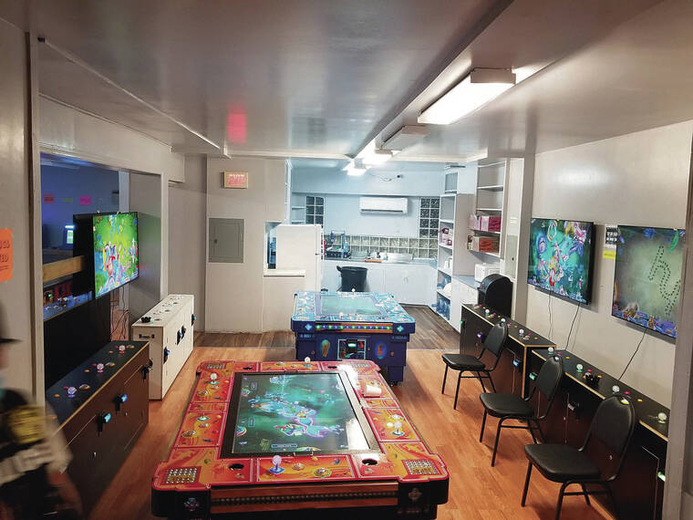 COURTESY HPD
                                Game machines are seen in an illegal gambling room in Liliha.