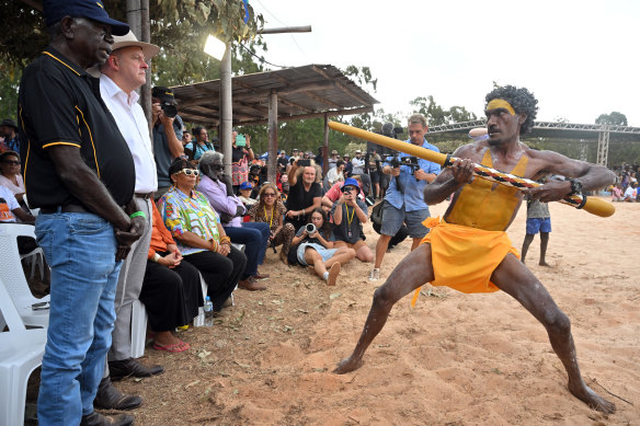 A member of the Gumatj clan of the Yolngu people presents Albanese a sceptre during the Garma Festival.