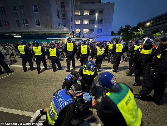 Police officers arrest far-right protesters after trouble flared in Plymouth on Monday night